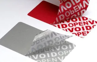 A partially lifted label showing permanent void marking