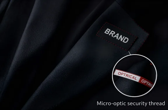 A tamper-evident optical security label applied to product packaging